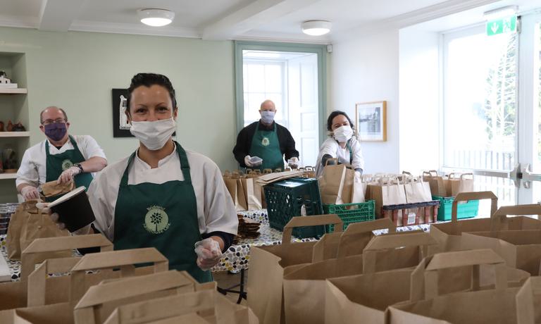 Volunteers from the local community packing emergency support packs