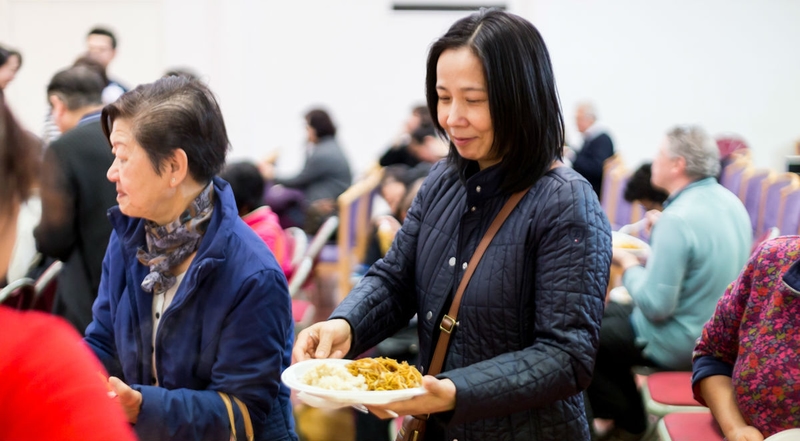 picture for projectStory: Woman being served food at Newham Chinese Association