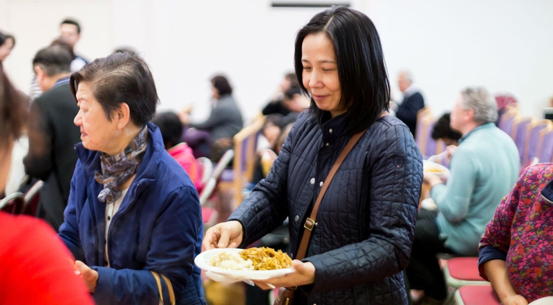 picture for projectStory: Woman being served food at Newham Chinese Association picture for projectStory: Woman being served food at Newham Chinese Association