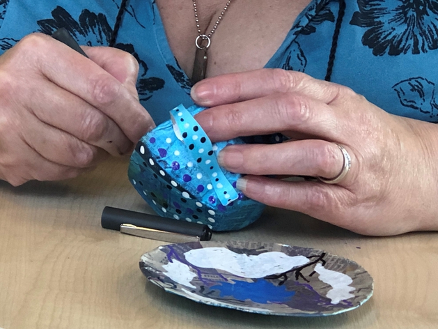 picture for projectStory: a hand made cup and saucer being painted picture for projectStory: a hand made cup and saucer being painted